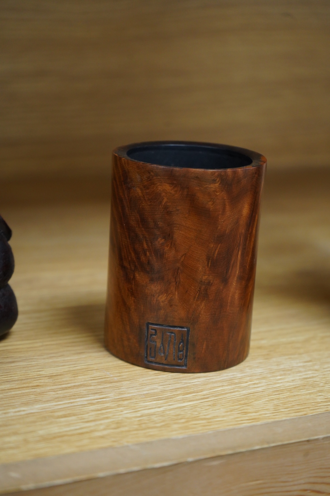 A Chinese burr wood brush pot, signed, and a gilt lacquered wood carving, 20cm